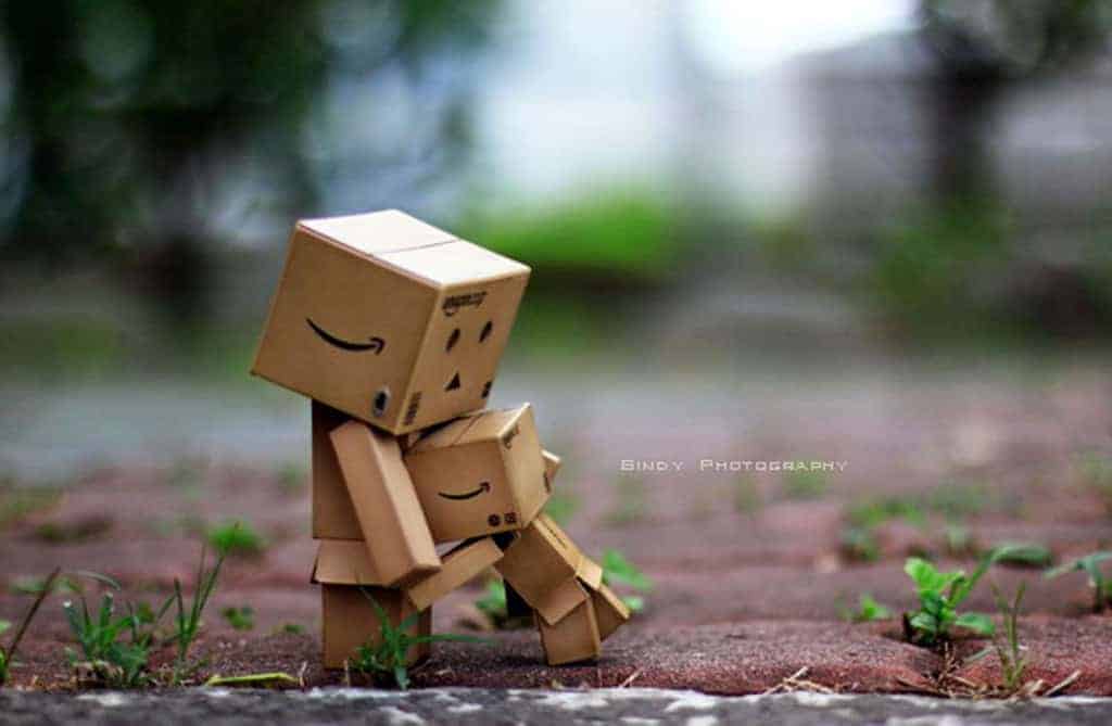 Amazon boxes sculpture art of child hugging mother