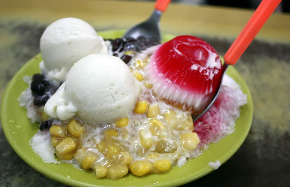 Stink fruit ice cream in a bowl with corn topping