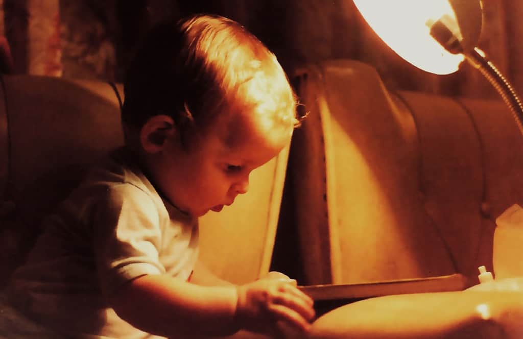 Infant looking at book