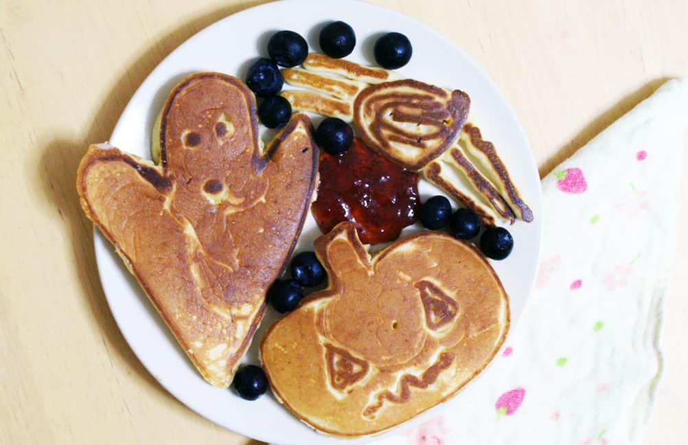 Plate of halloween shaped pumpkin pancakes